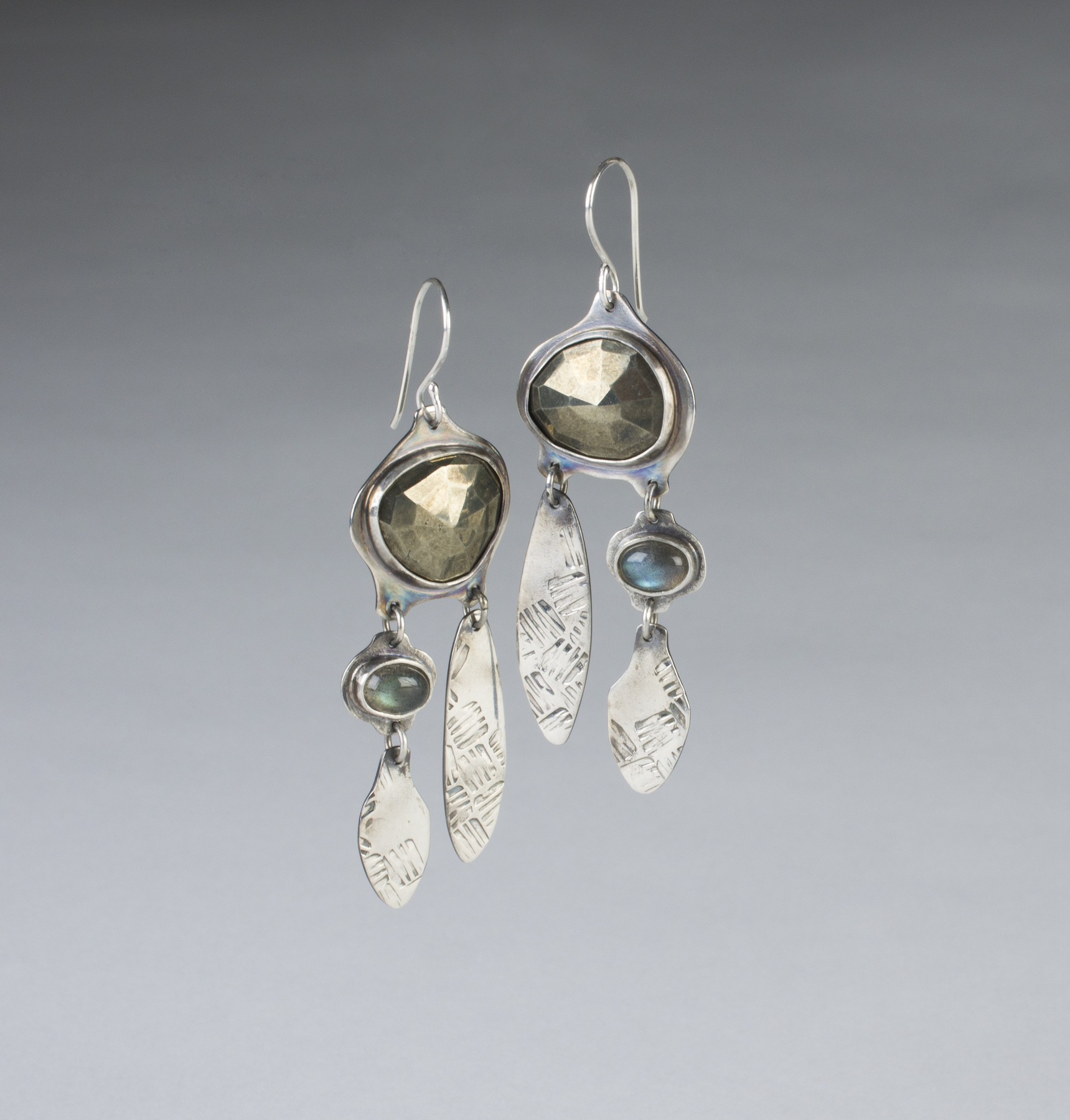 student made dangle earrings with gemstones and silver