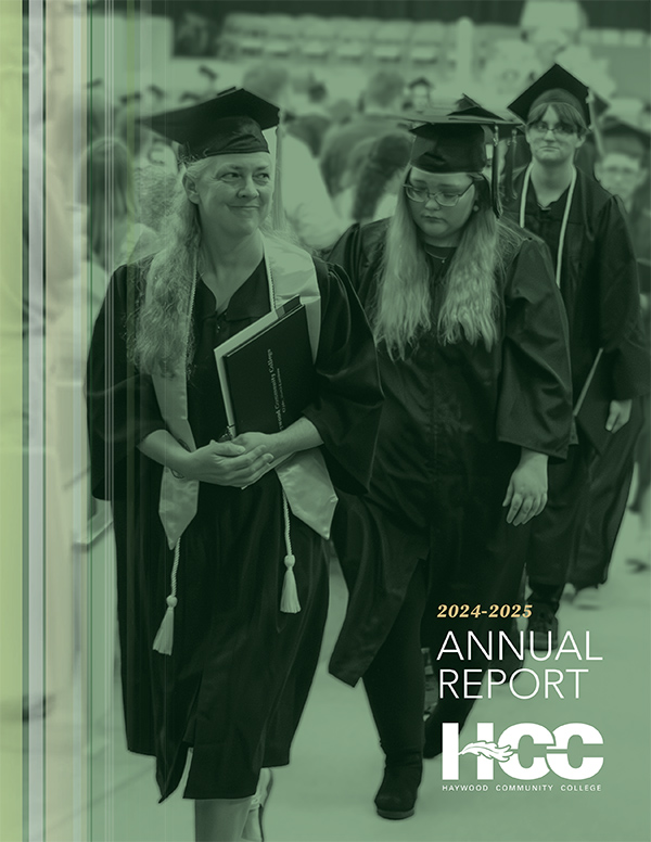 Graduates in caps and gowns walk in a commencement procession, with the Haywood Community College annual report text overlaid.