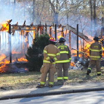 Firemen at structure burning