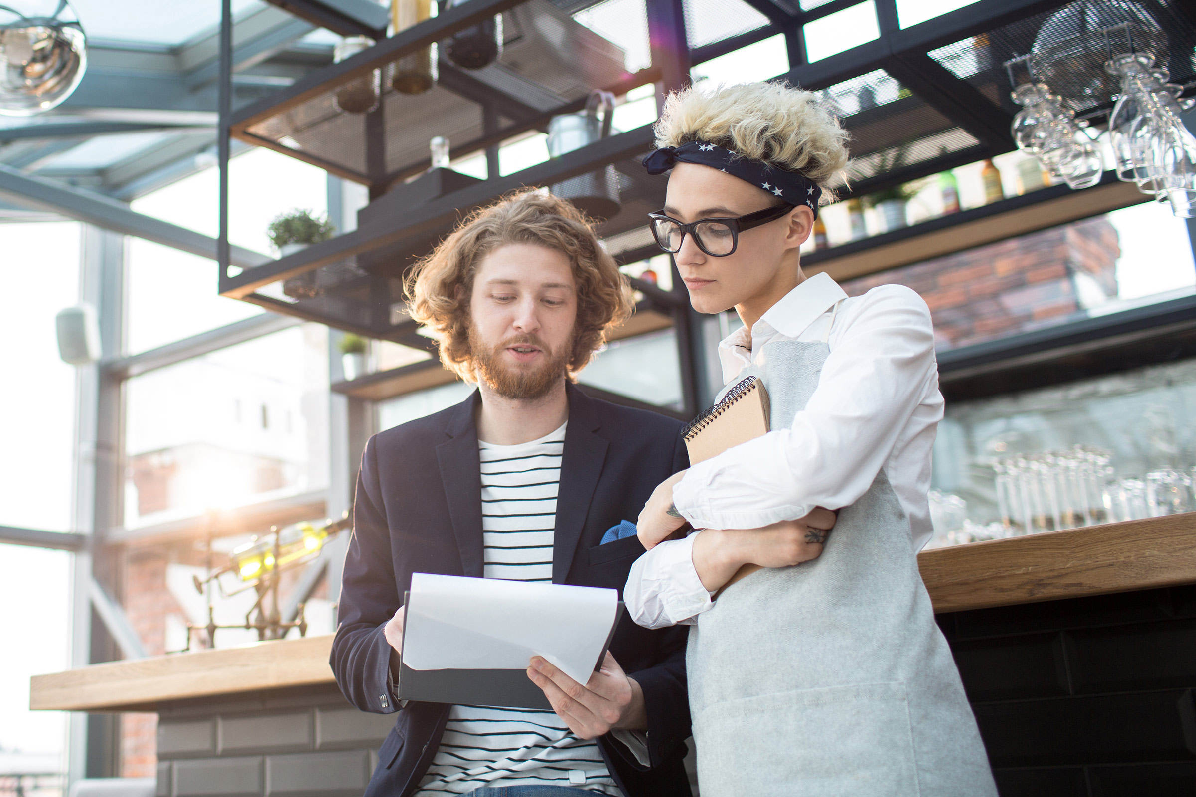 a manager and a chef view a worksheet