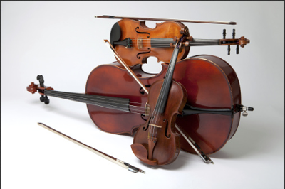 A stack of instruments such as violins and cellos against a stark white background.