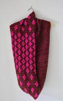 pink shaded knitted cowl on hanger
