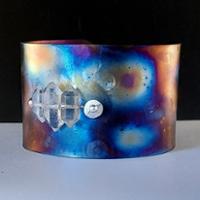 A jewelry cuff on a dark background