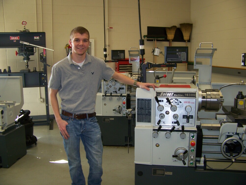 Student next to machine