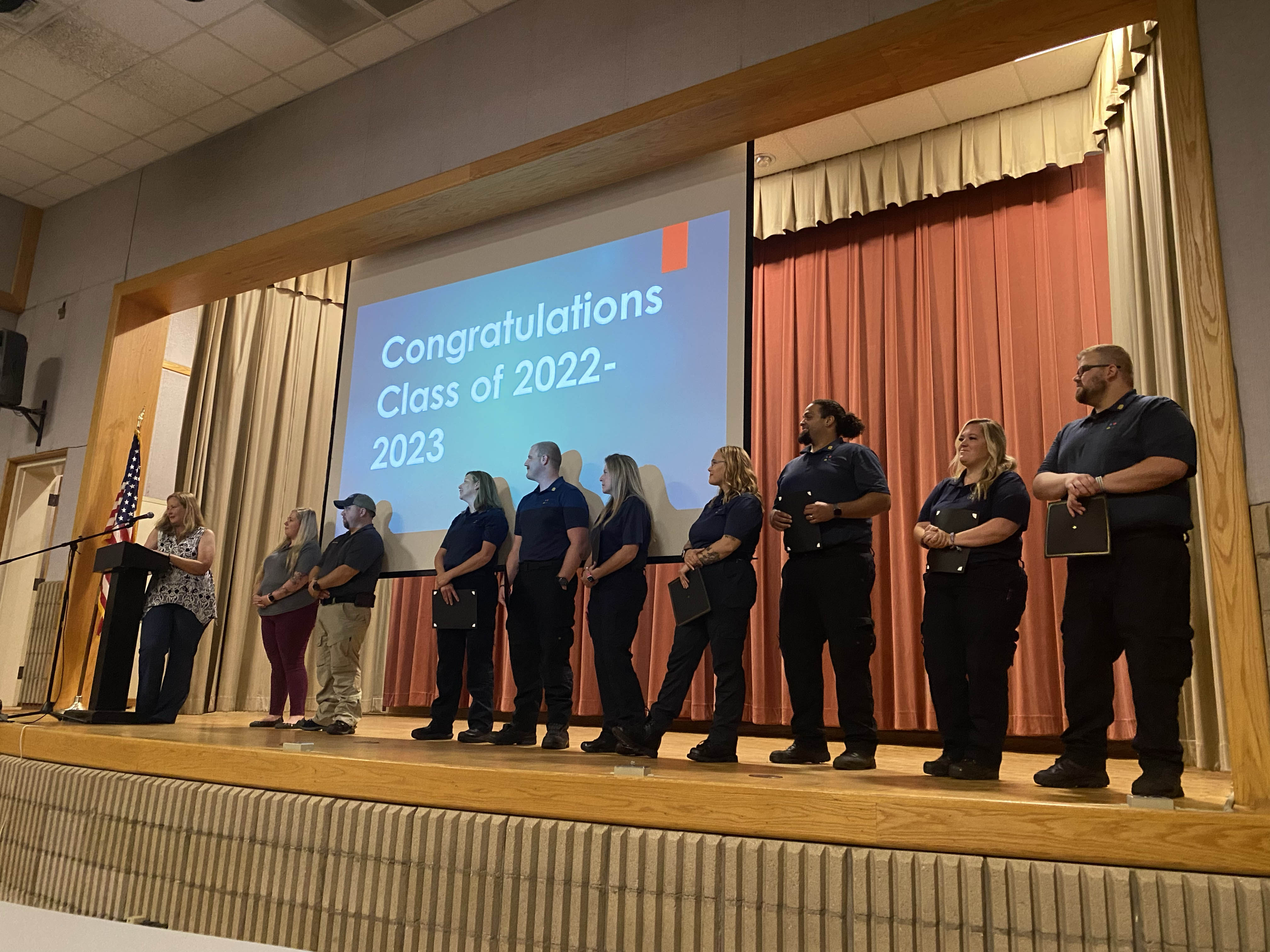 paramedic students on stage at graduation