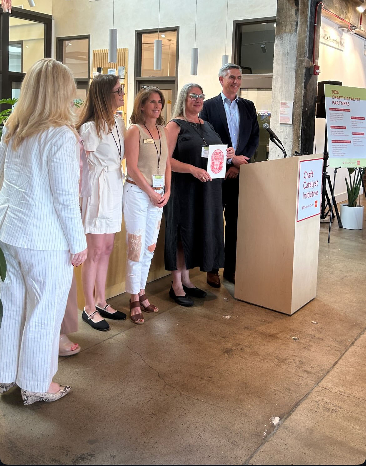 Employees from HCC receiving grant from Governor Stein