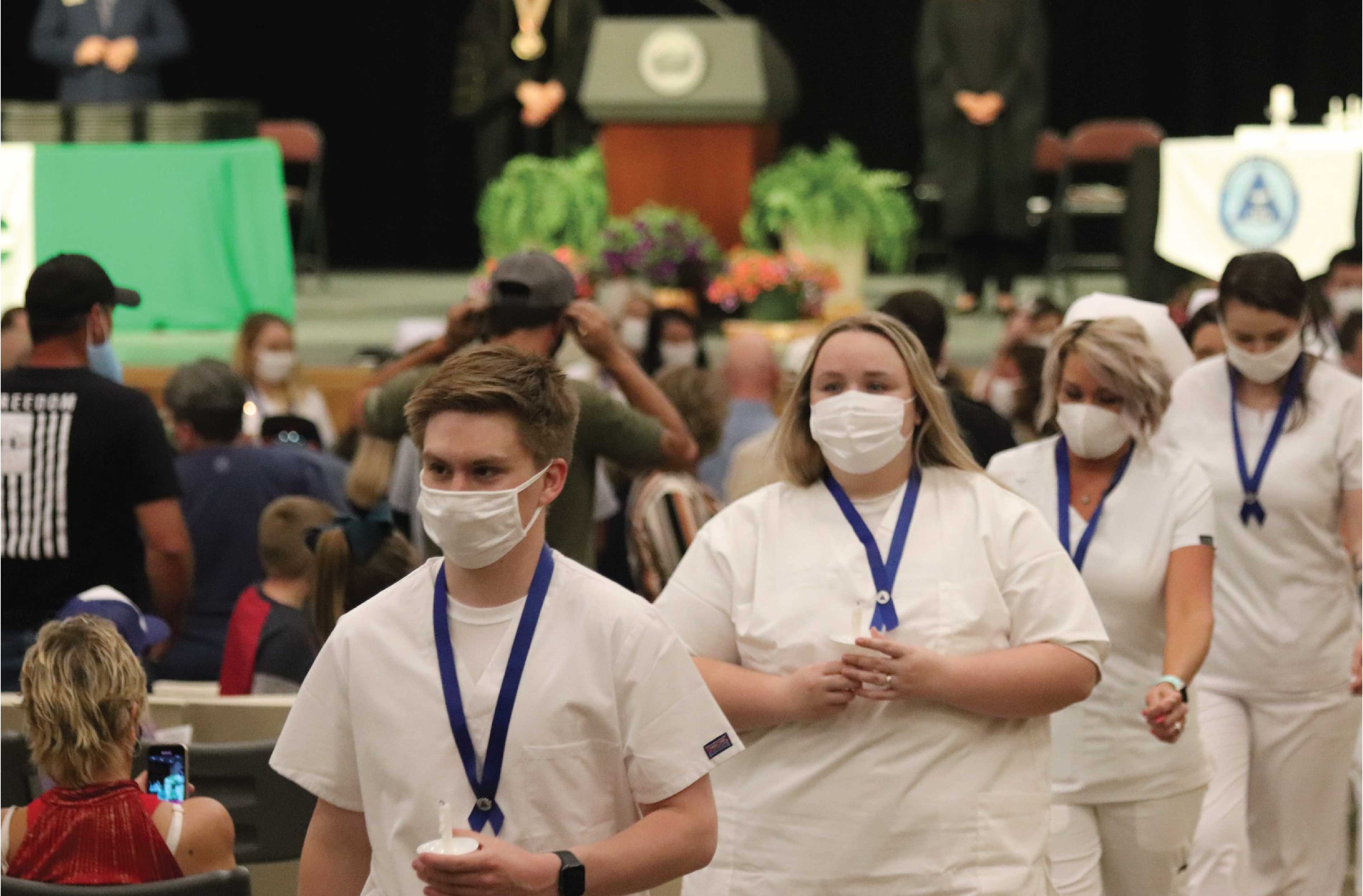 nurses walking at ceremony