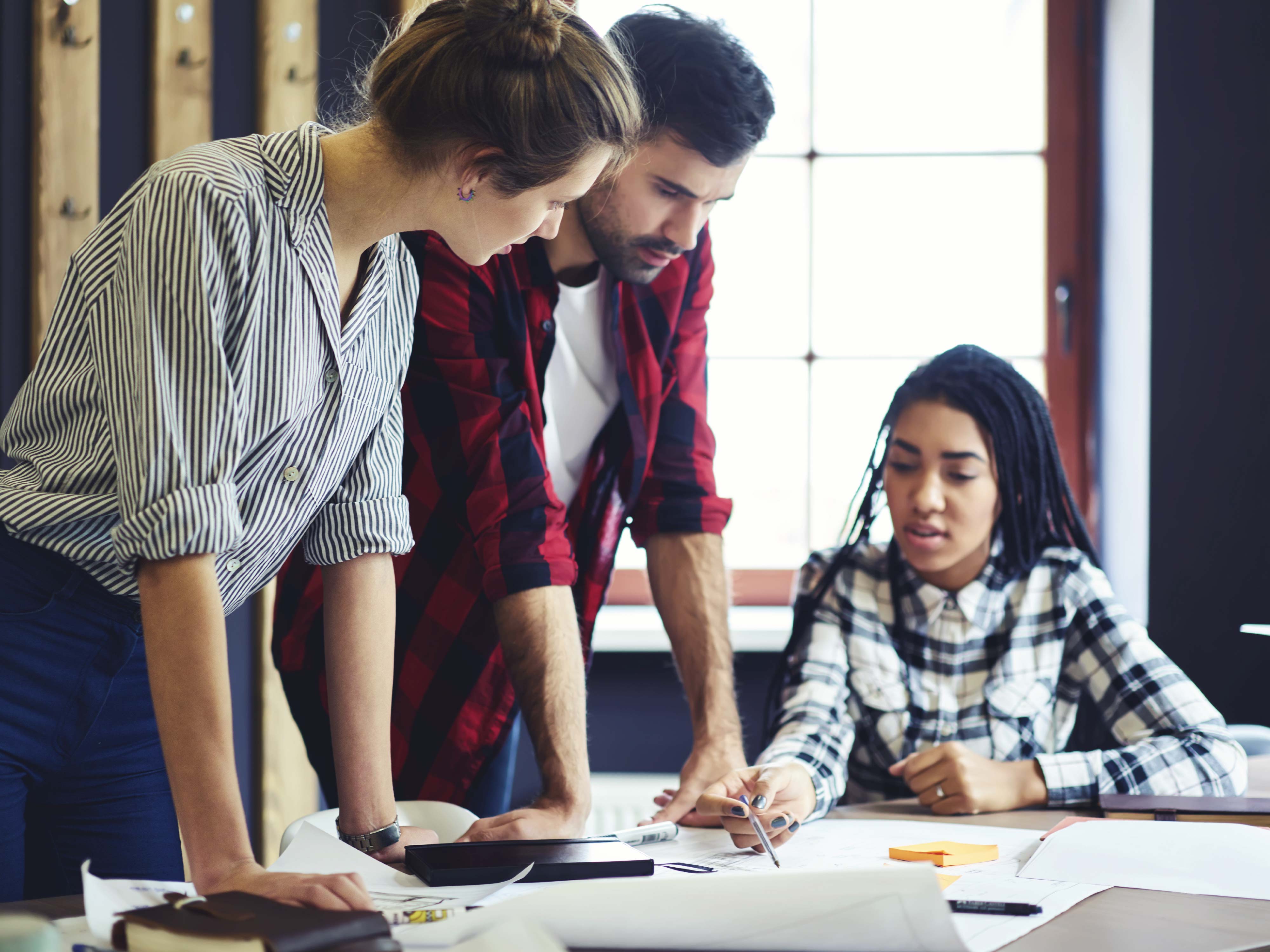 three people consulting engineering