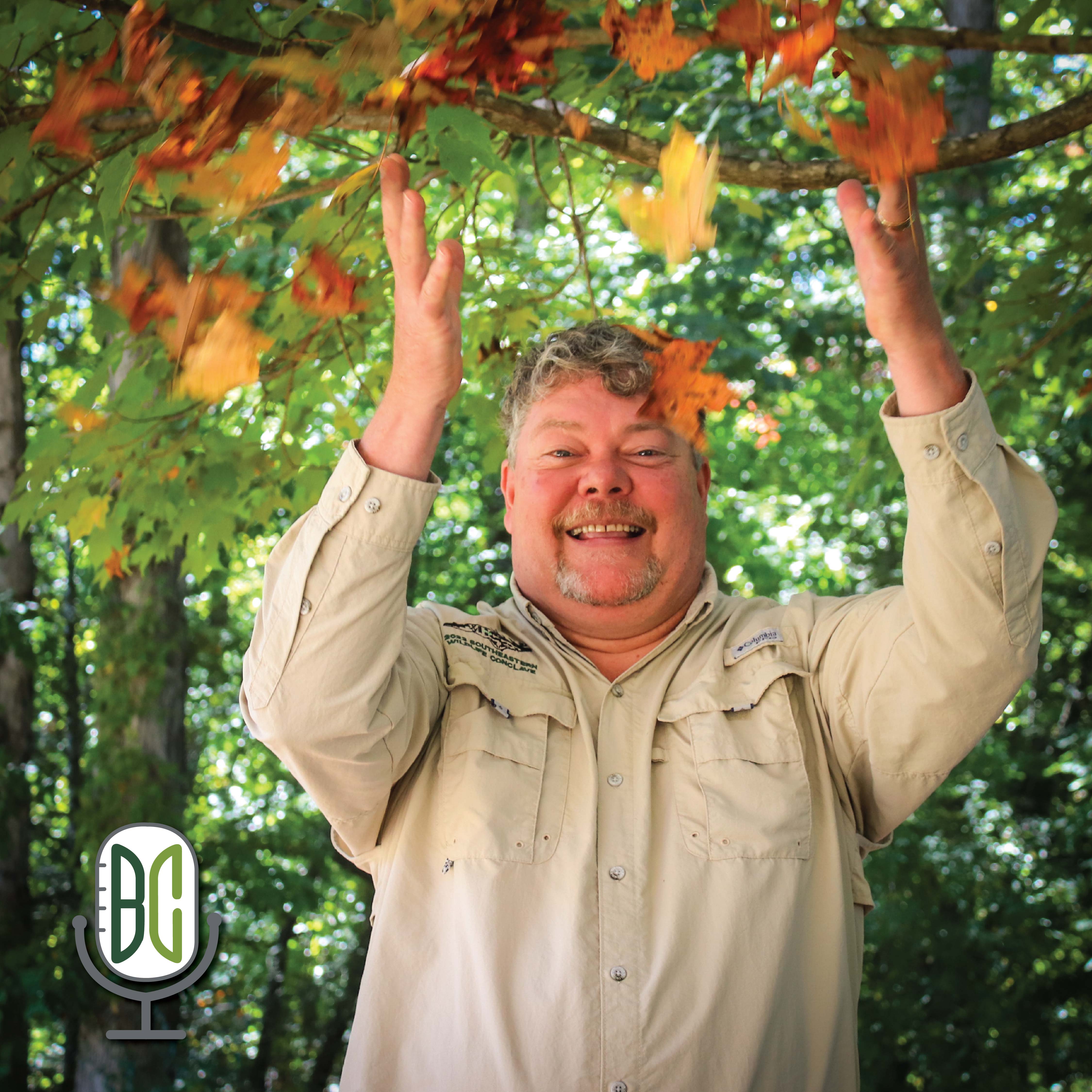 Shannon Rabby throwing leaves in the air