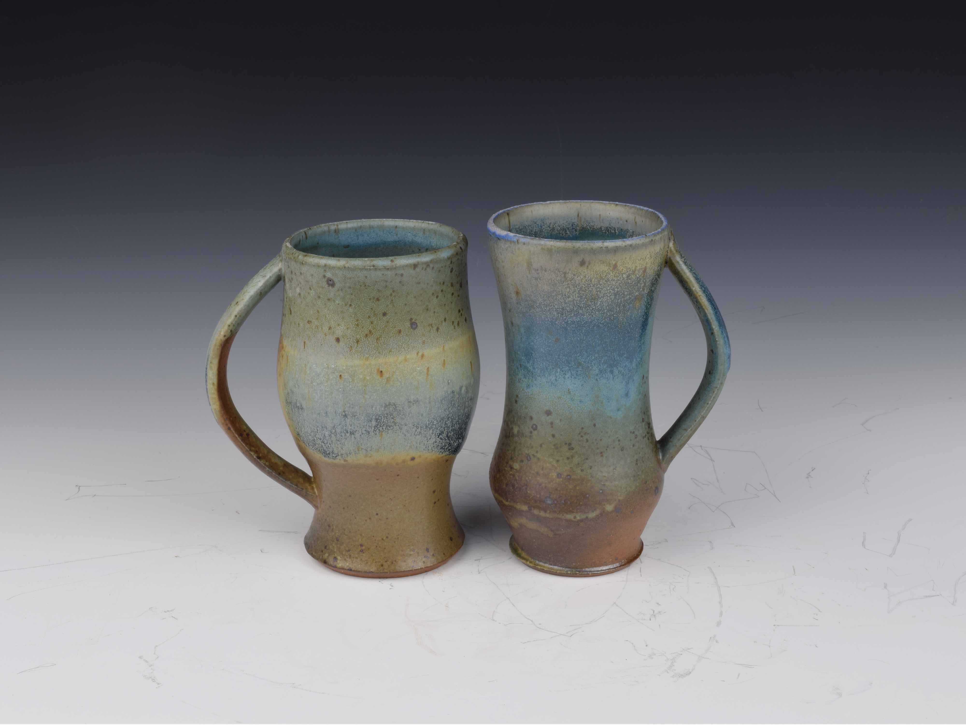 two clay mugs