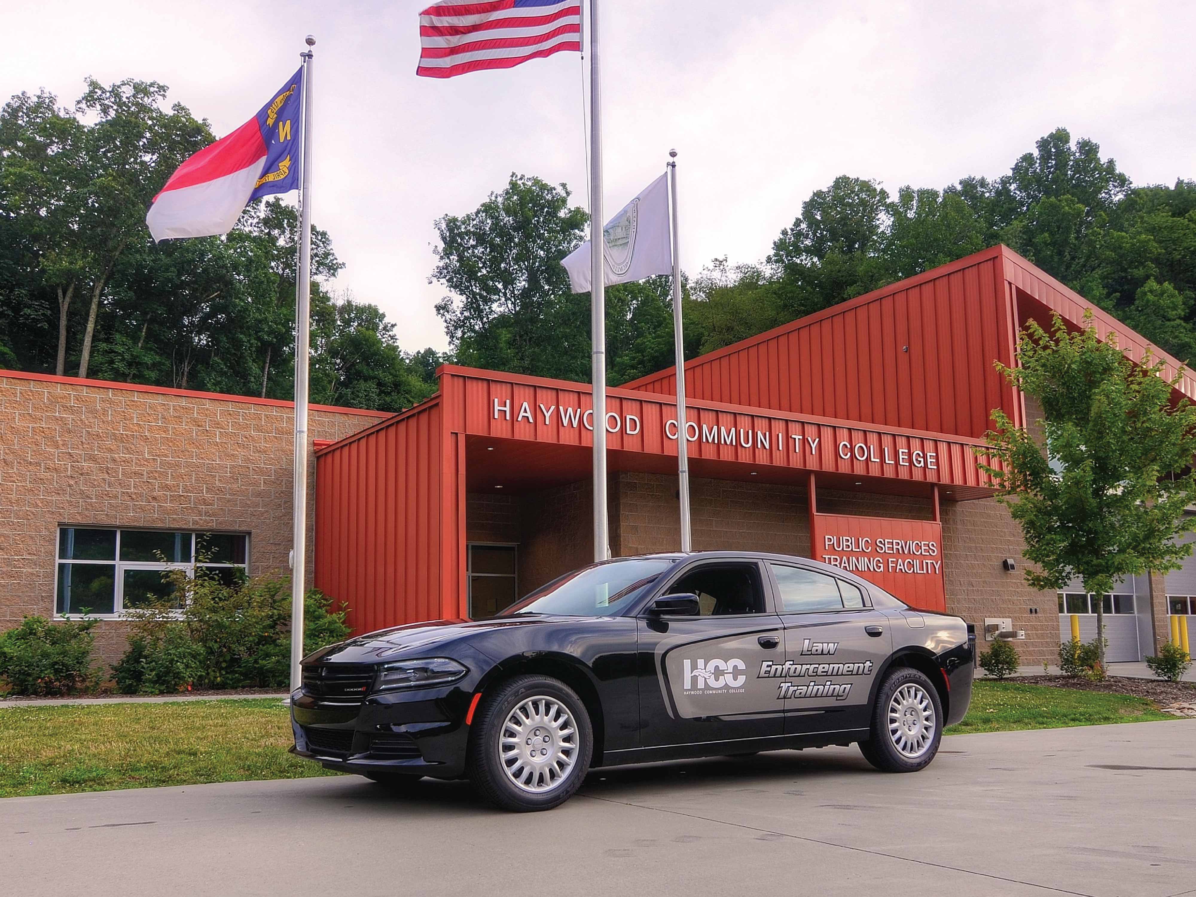 law enforcement car in front of building