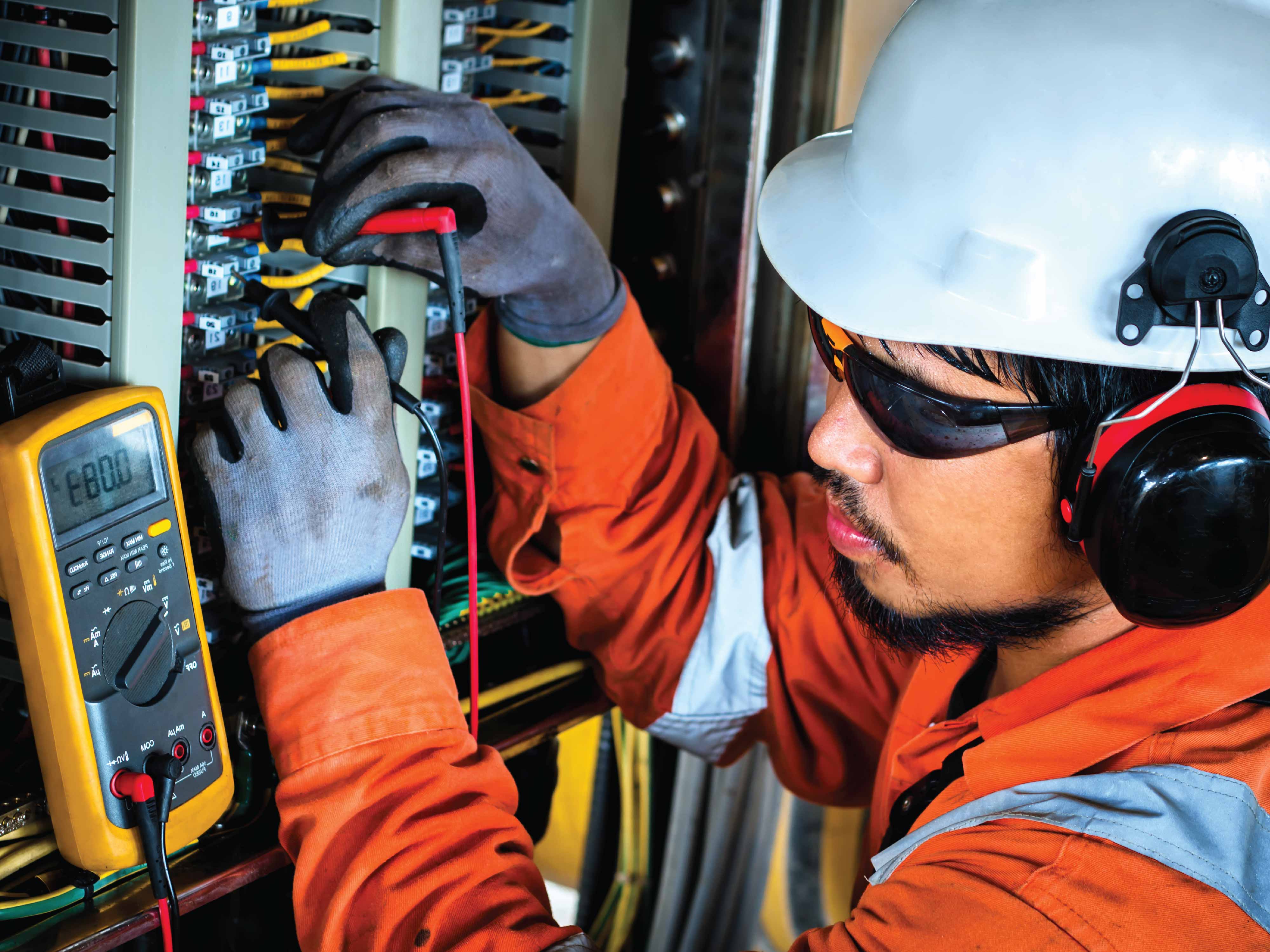 man working on electrical system