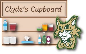 Clyde the bobcat beside a cupboard of food and personal care items.